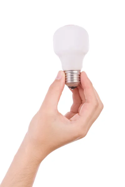 Hand holding an incandescent light bulb isolated on white — Stock Photo, Image