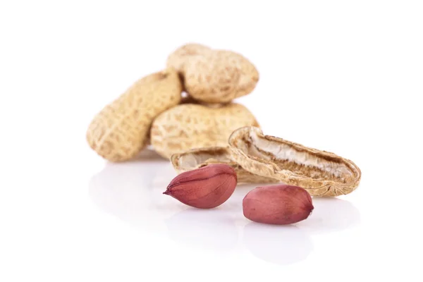 Peanuts cracked open isolated on a white background — Stock Photo, Image