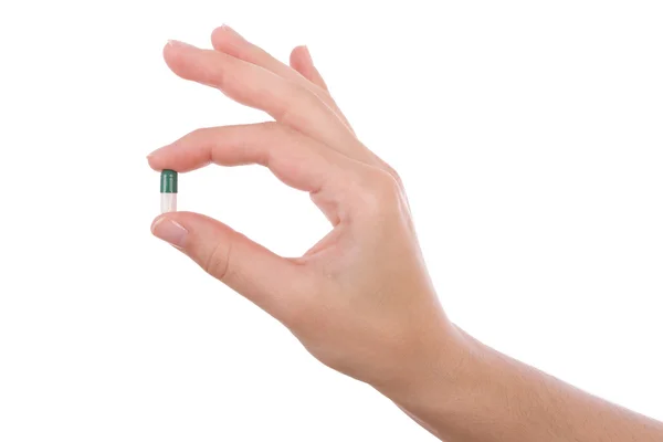 Kezében egy kapszula vagy tabletta elszigetelt fehér — Stock Fotó
