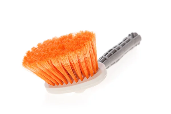 Paintbrush or small broom used for whitewashing walls or sweeping on white — Stock Photo, Image