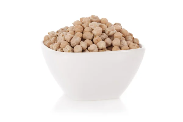 White chickpeas in a bowl isolated on a white background — Stock Photo, Image