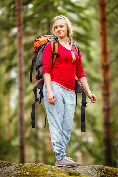 Young woman hiking in the forest.