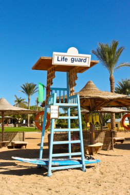 a seat for lifeguard at the beach clipart