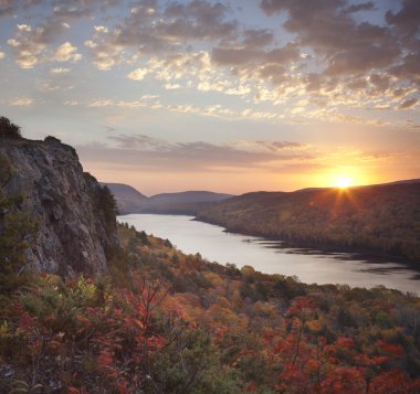 Lake of the Clouds, Michigan in peak fall color at sunrise clipart