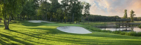 Panoramic view of golf green with white sand traps — Stock Photo, Image