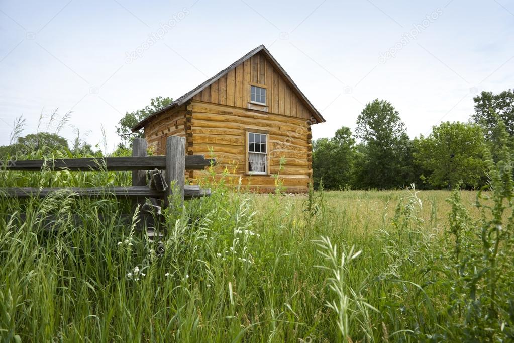 Early settlers' log cabin on the prairie