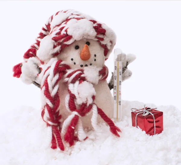 Snowman with the thermometer and gift — Stock Photo, Image