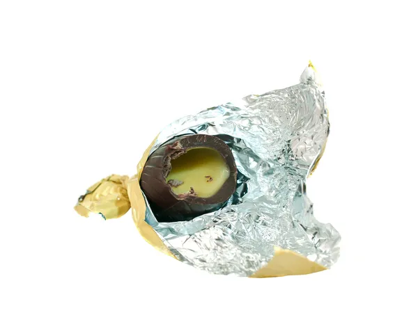 Sweet chocolate candy unwrapped in golden foil — Stock Photo, Image