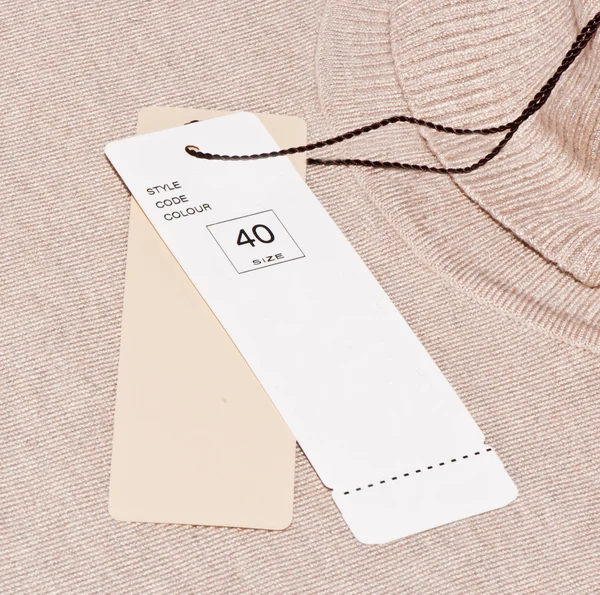 The label is attached to a sweater — Stock Photo, Image