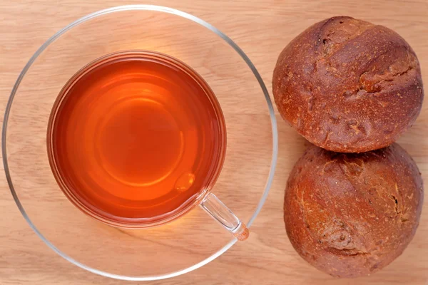 Cup of tea and two fresh buns — Stock Photo, Image