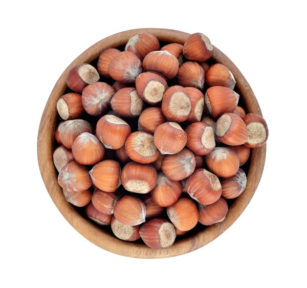 Hazelnuts in a wooden bowl on a white background — Stock Photo, Image