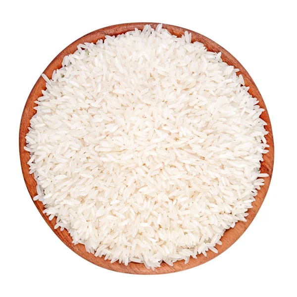 Uncooked rice in a wooden bowl on a white background — Stock Photo, Image