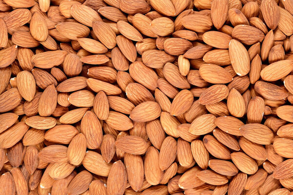 Peeled almonds background