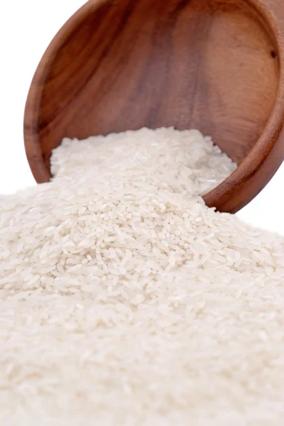 Uncooked rice in a wooden bowl — Stock Photo, Image