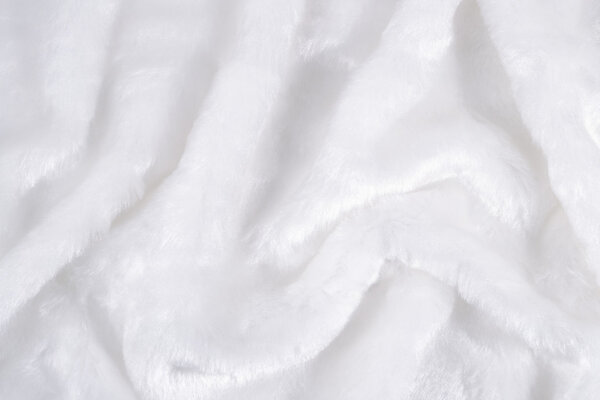 The surface of the white faux fur