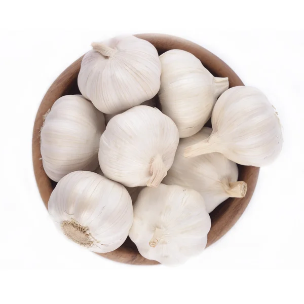 Garlic in a wooden bowl — Stock Photo, Image