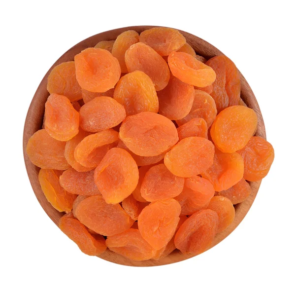 Dried apricots in a wooden bowl — Stock Photo, Image