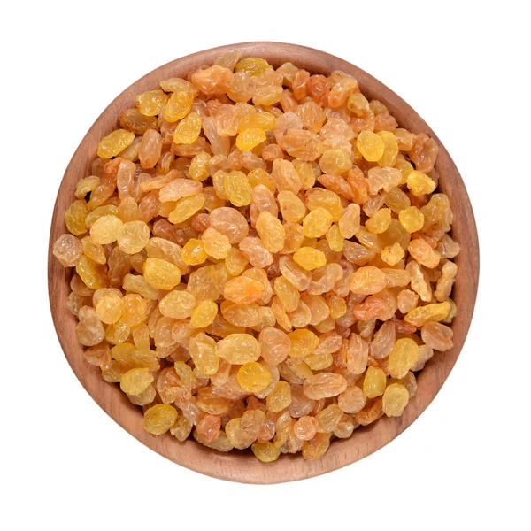 Golden raisins in a wooden bowl — Stock Photo, Image