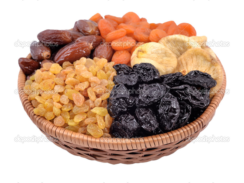 Various dried fruits in wicker bowl