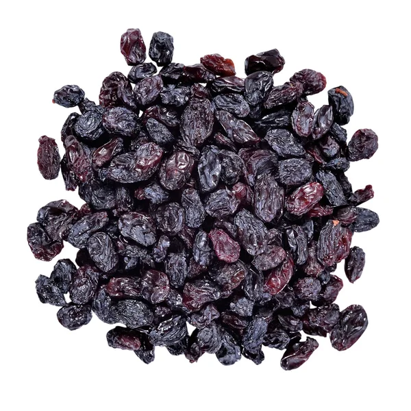 Heap of dark raisins on a white — Stock Photo, Image