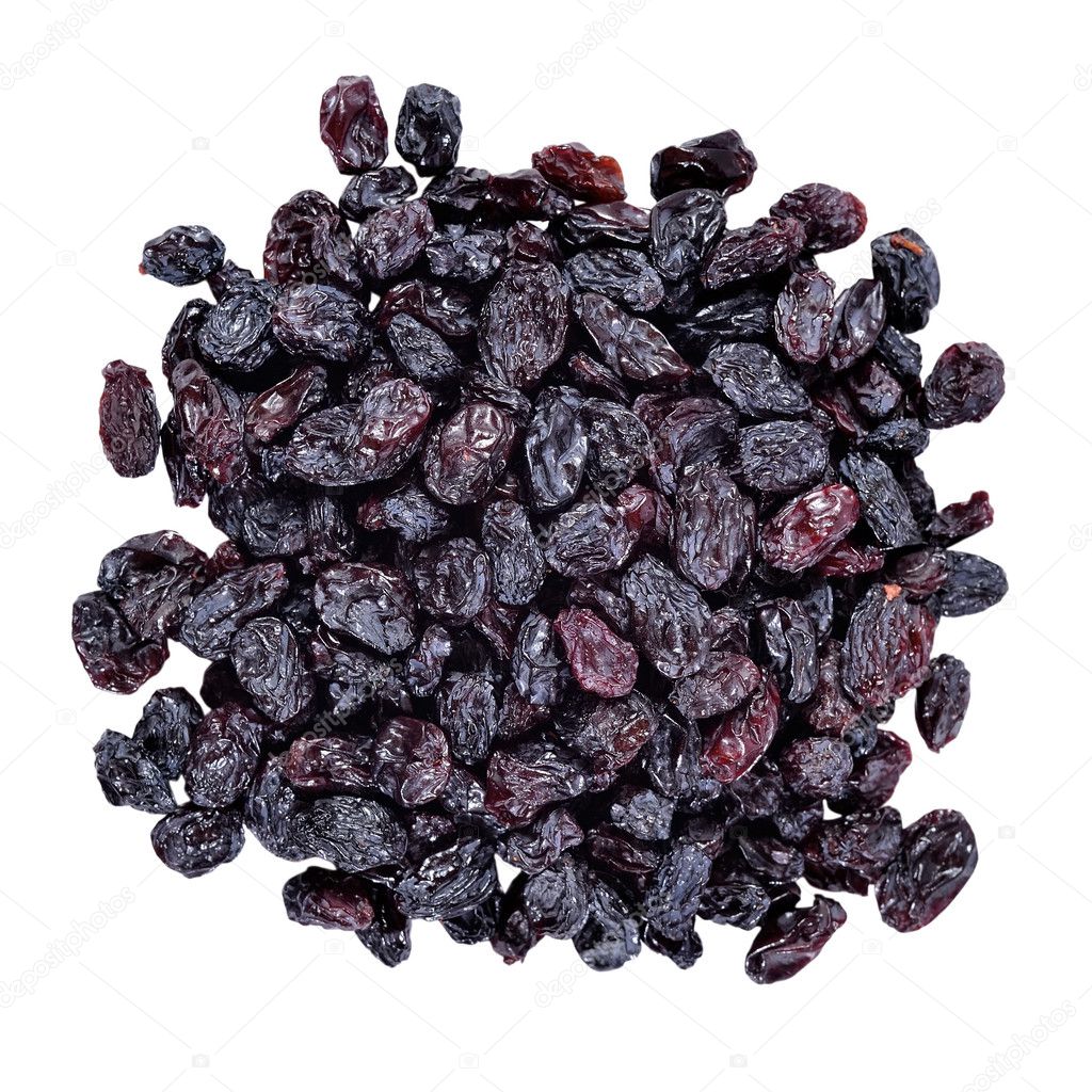 Heap of dark raisins on a white