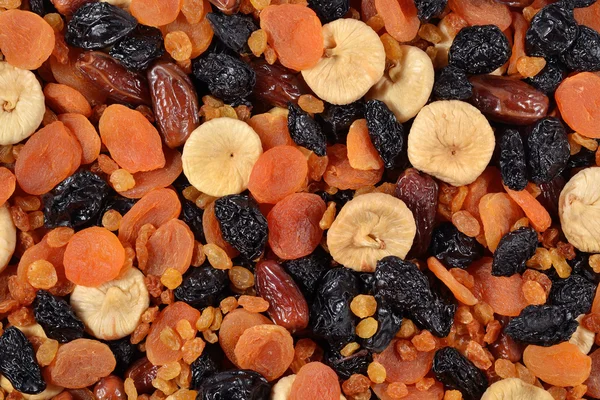 Assorted dried fruits background — Stock Photo, Image