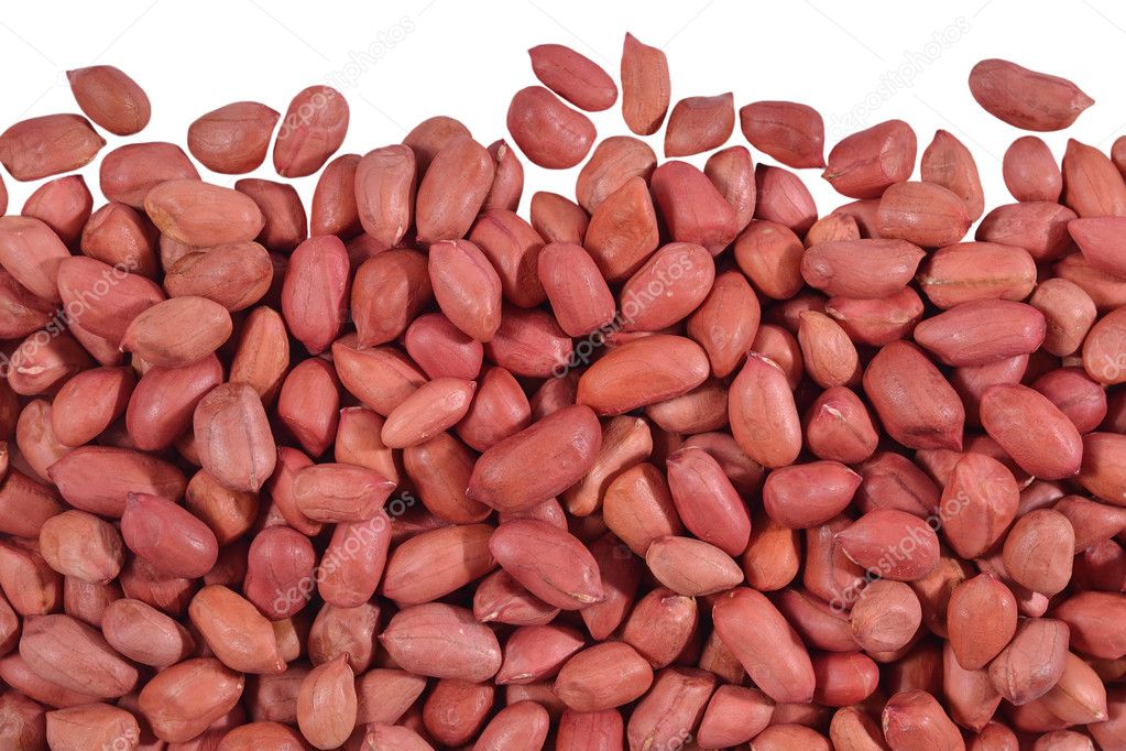 Heap of peeled peanuts on a white