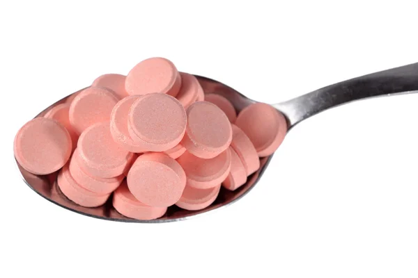 Wiele tabletek w łyżka — Zdjęcie stockowe