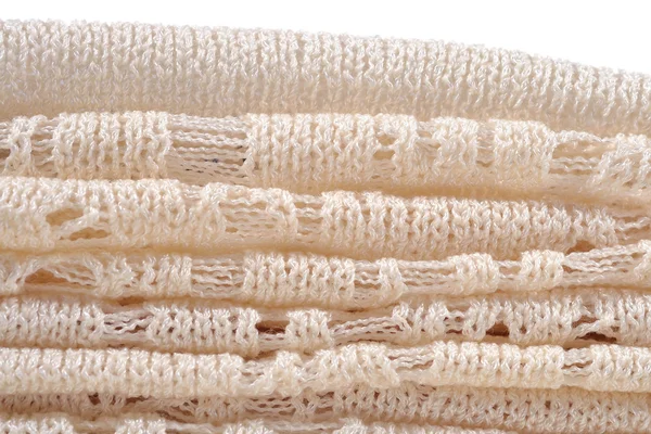 Pila di tessuto lavorato a maglia traforato bianco — Foto Stock