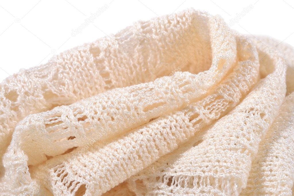 Stack of white openwork knitted fabric