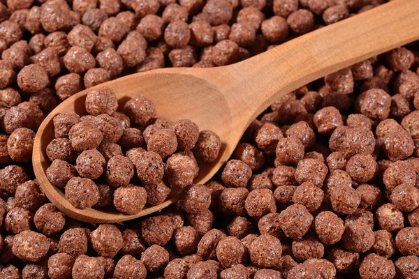 Chocolate cereal balls in a spoon — Stock Photo, Image