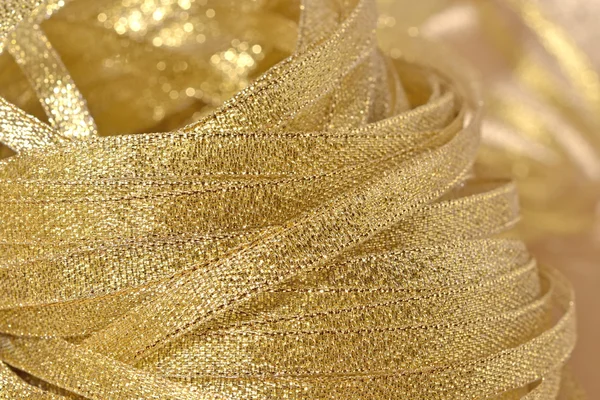 Golden ribbons close up — Stock Photo, Image