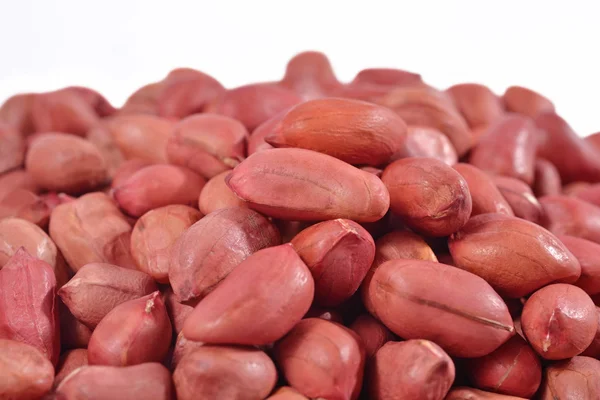 Heap of peeled peanuts on a white — Stock Photo, Image