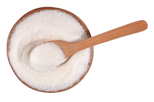 Açúcar branco em uma tigela de madeira em um branco — Fotografia de Stock