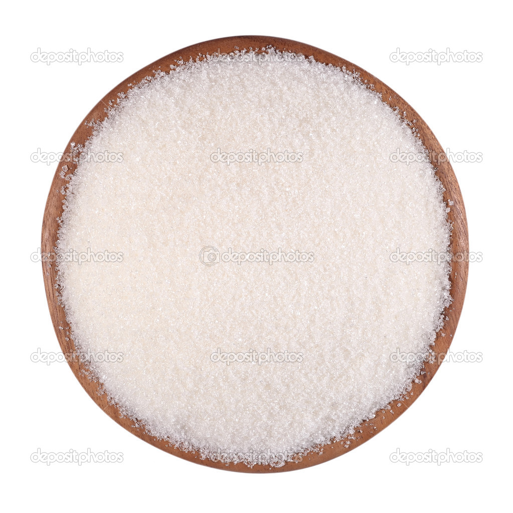 White sugar in a wooden bowl on a white