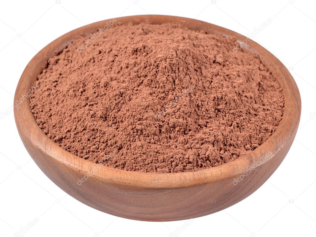 Cocoa powder in a wooden bowl on a white