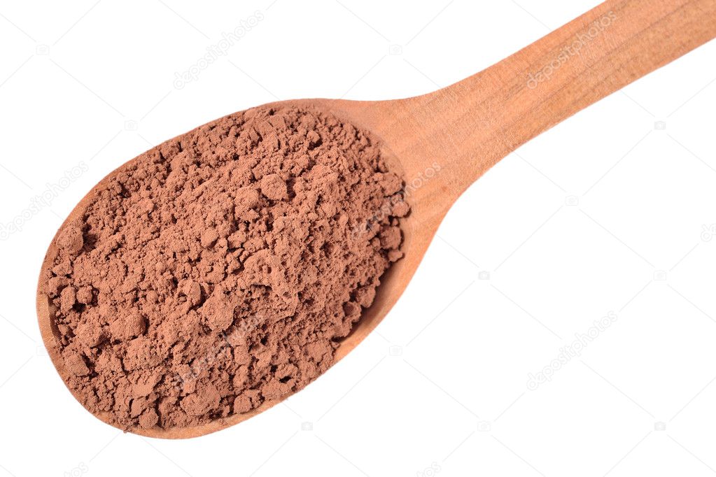Cocoa powder in a wooden spoon on a white