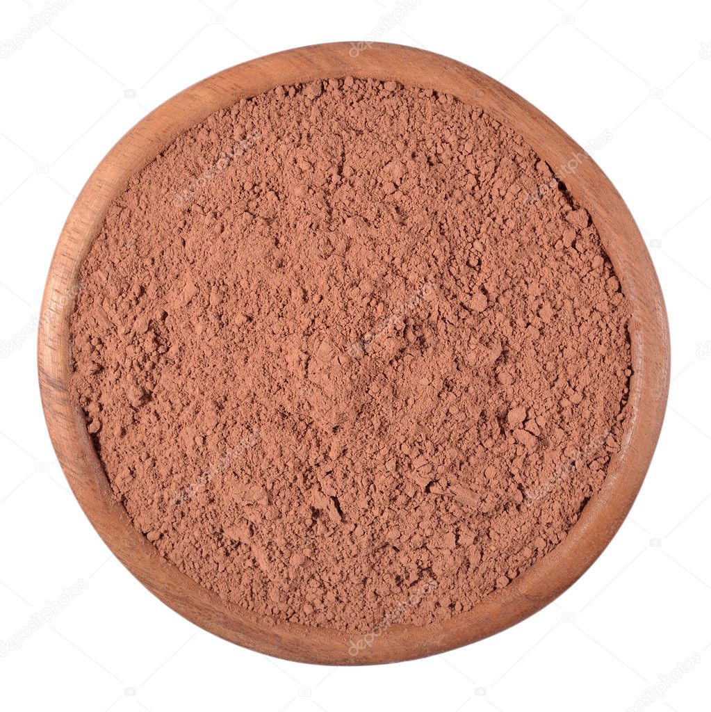 Cocoa powder in a wooden bowl on a white