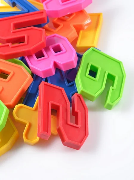 Colorful plastic numbers on a white — Stock Photo, Image