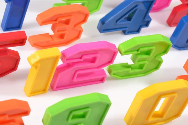 Colorful plastic numbers 123 on white — Stock Photo, Image