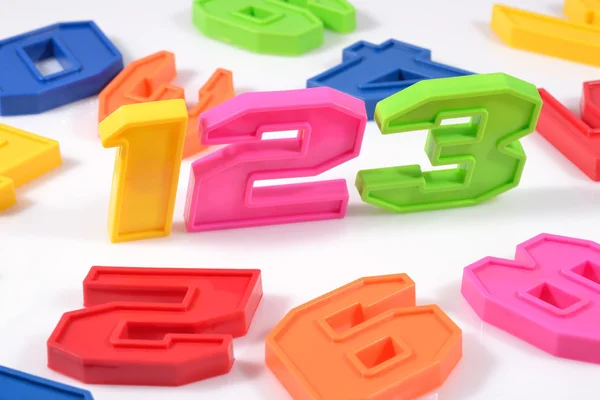 Colorful plastic numbers 123 on white — Stock Photo, Image