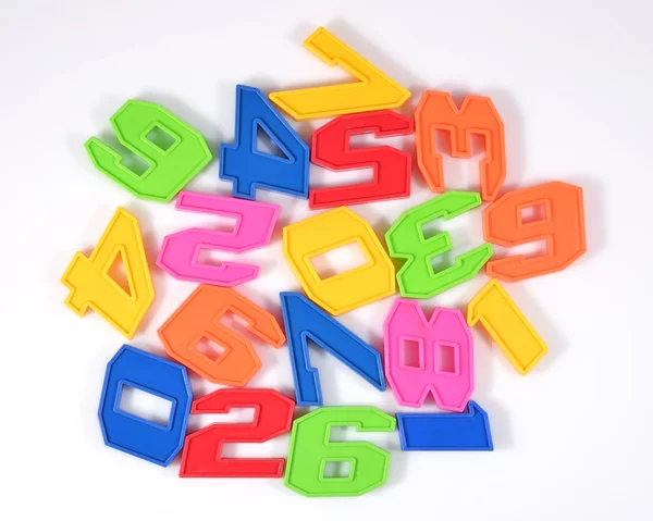 Colorful plastic numbers on a white — Stock Photo, Image