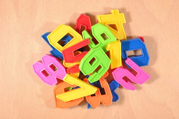 Heap of plastic colored numbers — Stock Photo, Image