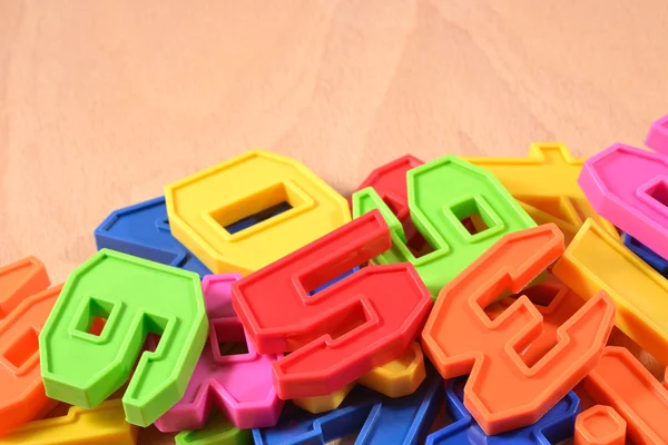 Heap of plastic colored numbers — Stock Photo, Image