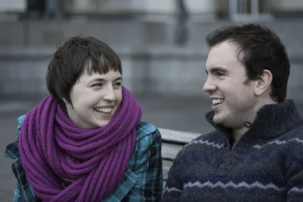 Laughing young couple enjoying winter weather Stock Picture