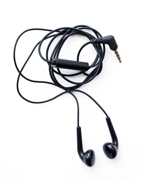 Black earphones on a white background — Stock Photo, Image