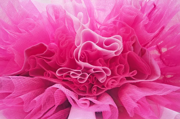Vrouwelijke roze stof achtergrond — Stockfoto