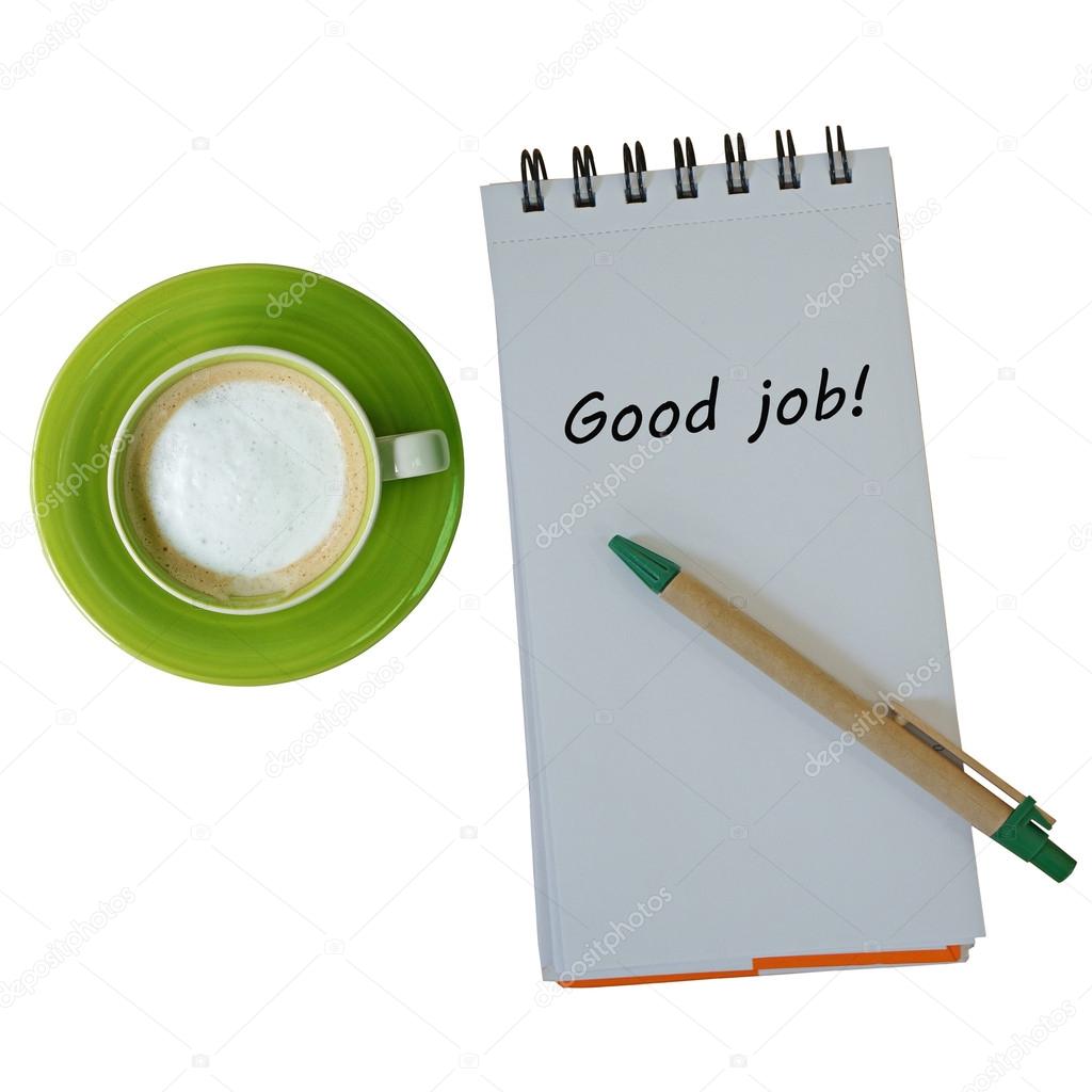Text good job on note book with pen and coffee cup isolated on white background