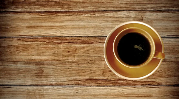 Kaffeetasse von oben auf altem Holz — Stockfoto