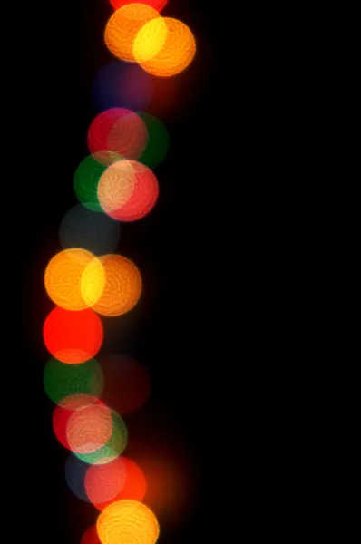 Christmas lights on dark background with copy space — Stock Photo, Image